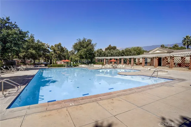 a view of outdoor space with swimming pool and seating