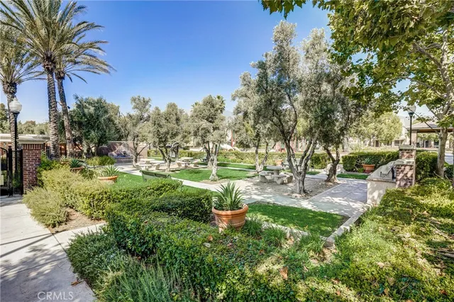 a view of a park with sitting area