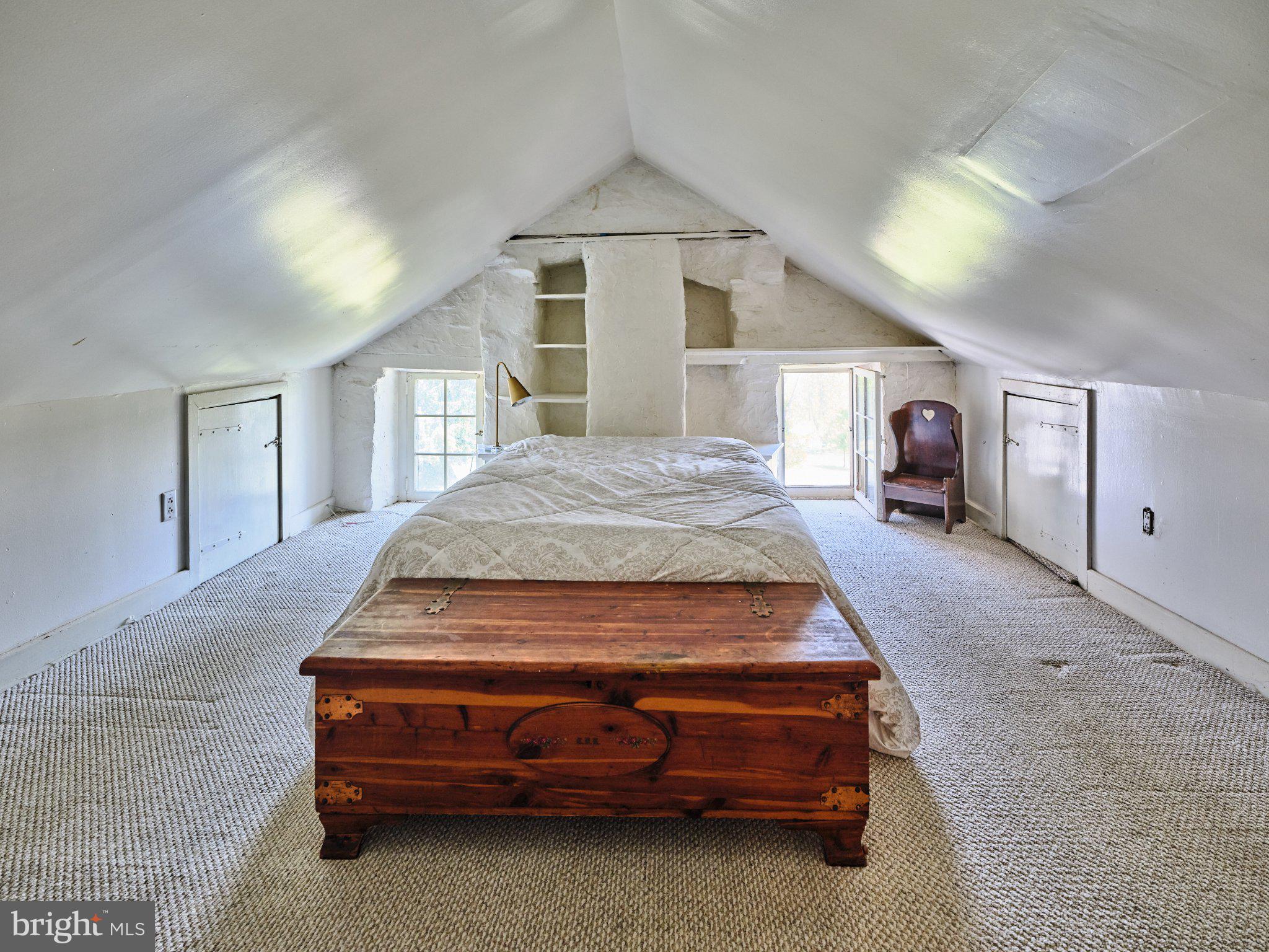 765 Swamp Road Newtown, PA 18940 - Photo 23 of 37 a bedroom with a bed and a large window