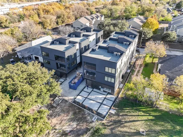 a aerial view of a house with a yard
