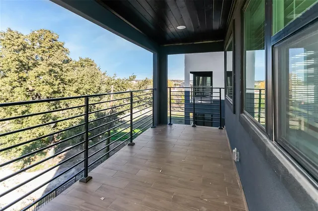 a view of a balcony with city view