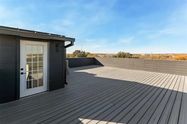 a view of outside space with wooden floor