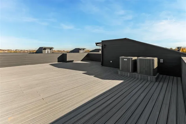 a black and white building with wooden floor