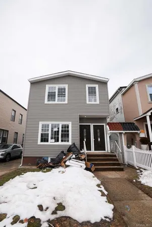 a front view of a house with yard