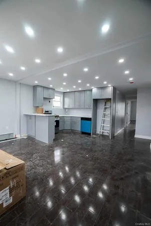 a view of kitchen appliances and cabinets