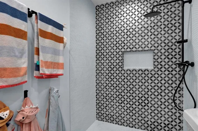 a bathroom with a sink a toilet and a shower curtain