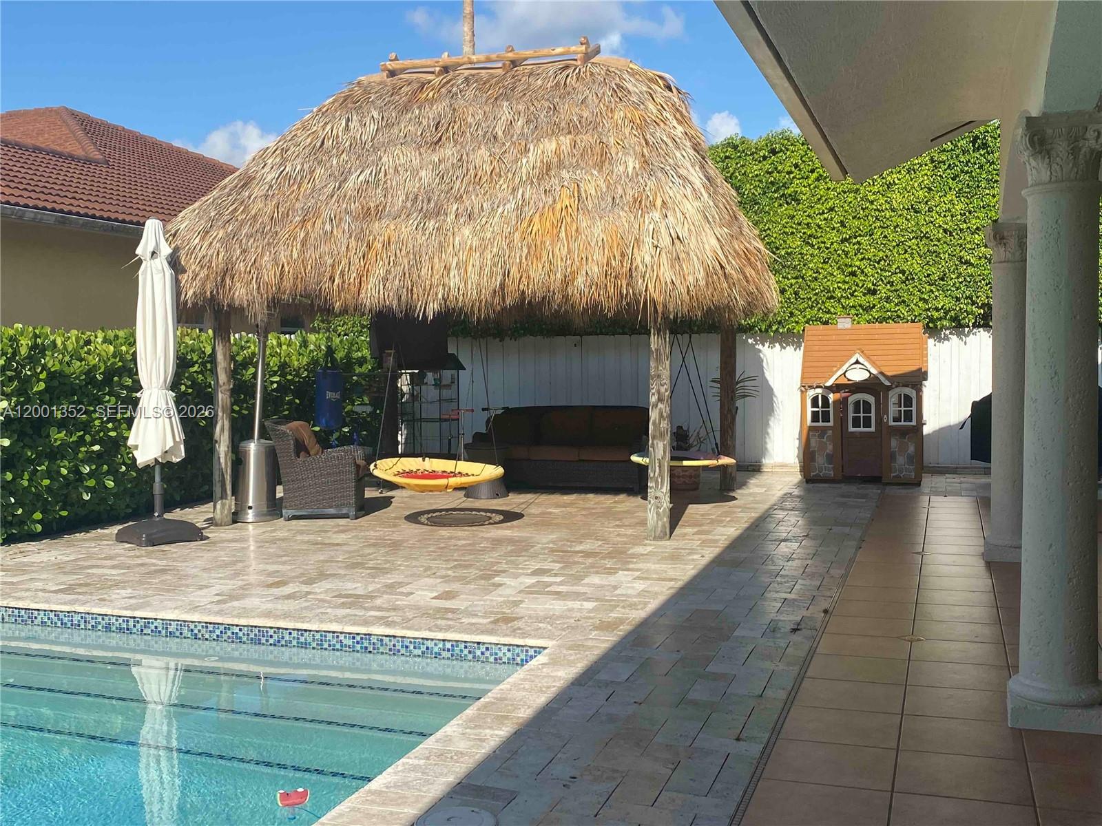 a view of a swimming pool with a patio