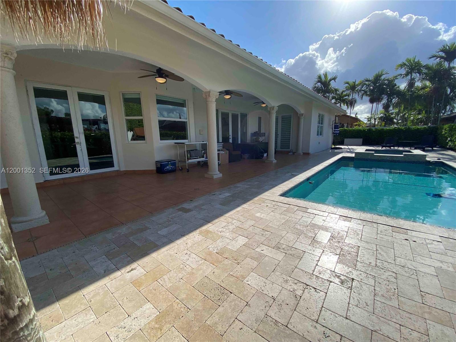 14302 Southwest 15th Street Miami, FL 33184 - Photo 12 of 63 a view of a house with swimming pool and sitting area