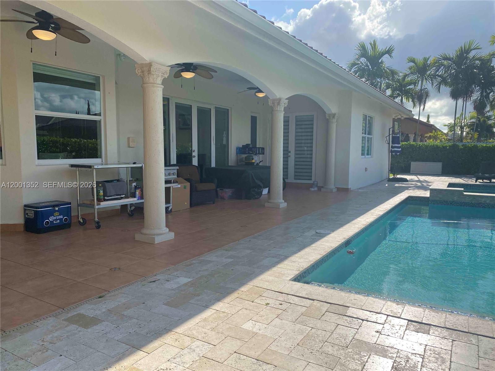 14302 Southwest 15th Street Miami, FL 33184 - Photo 13 of 63 a view of a house with backyard and porch