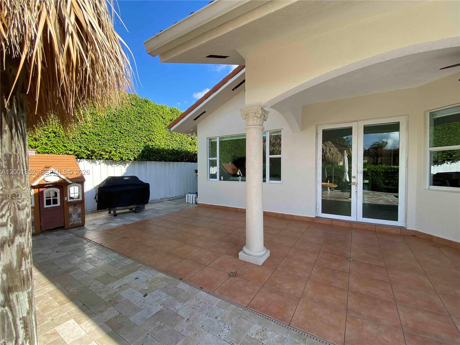 14302 Southwest 15th Street Miami, FL 33184 - Photo 14 of 63 a front view of a house with a yard