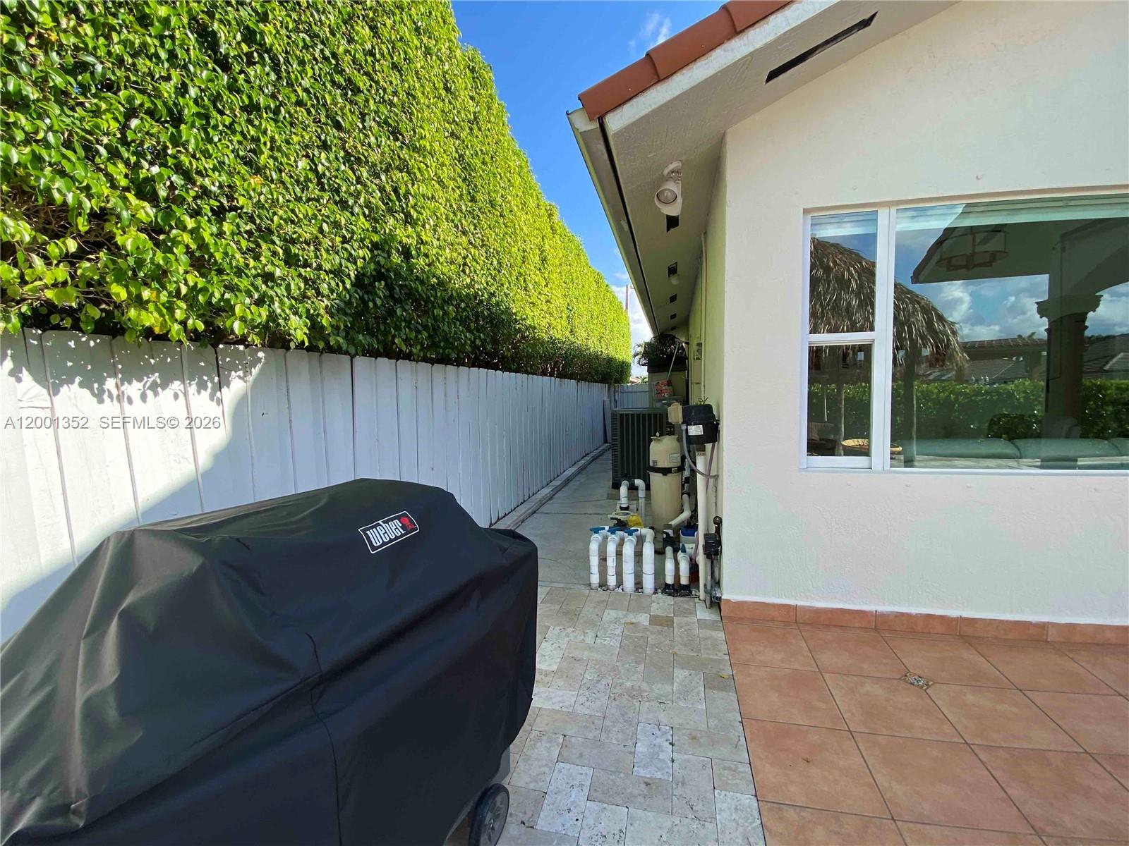 14302 Southwest 15th Street Miami, FL 33184 - Photo 16 of 63 a view of a chairs and table in patio