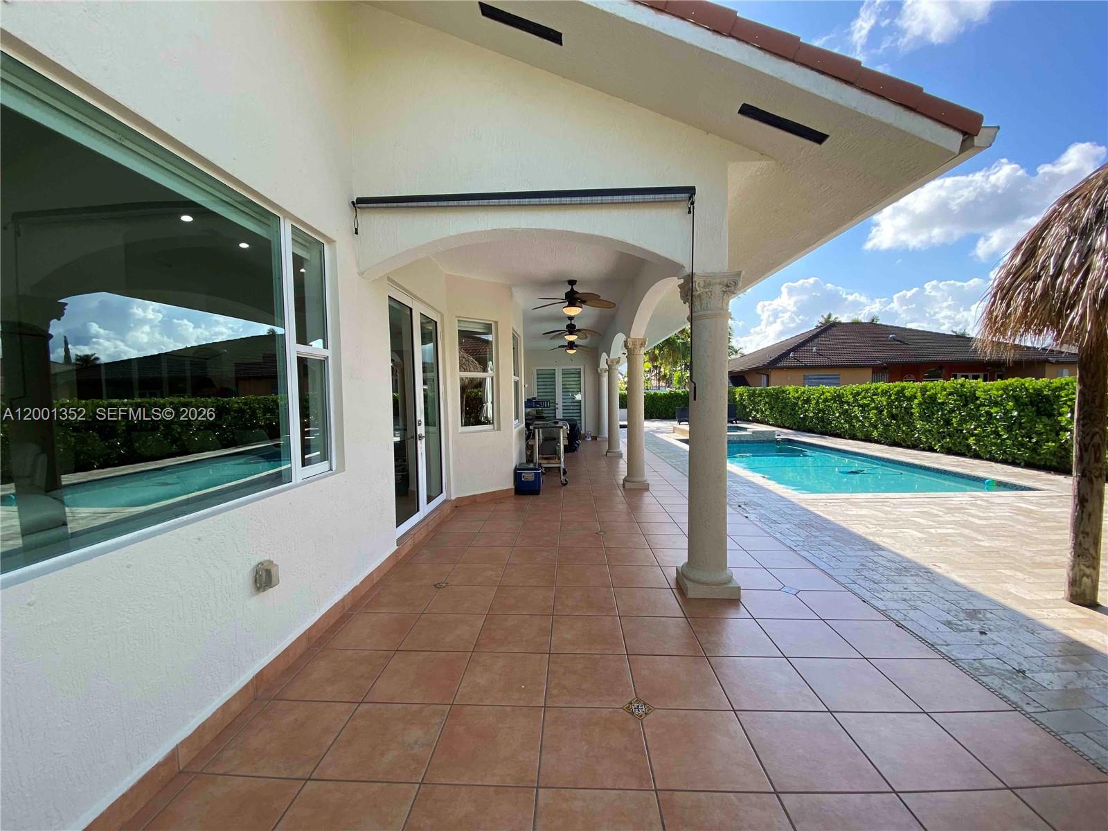 14302 Southwest 15th Street Miami, FL 33184 - Photo 18 of 63 a view of a house with a porch