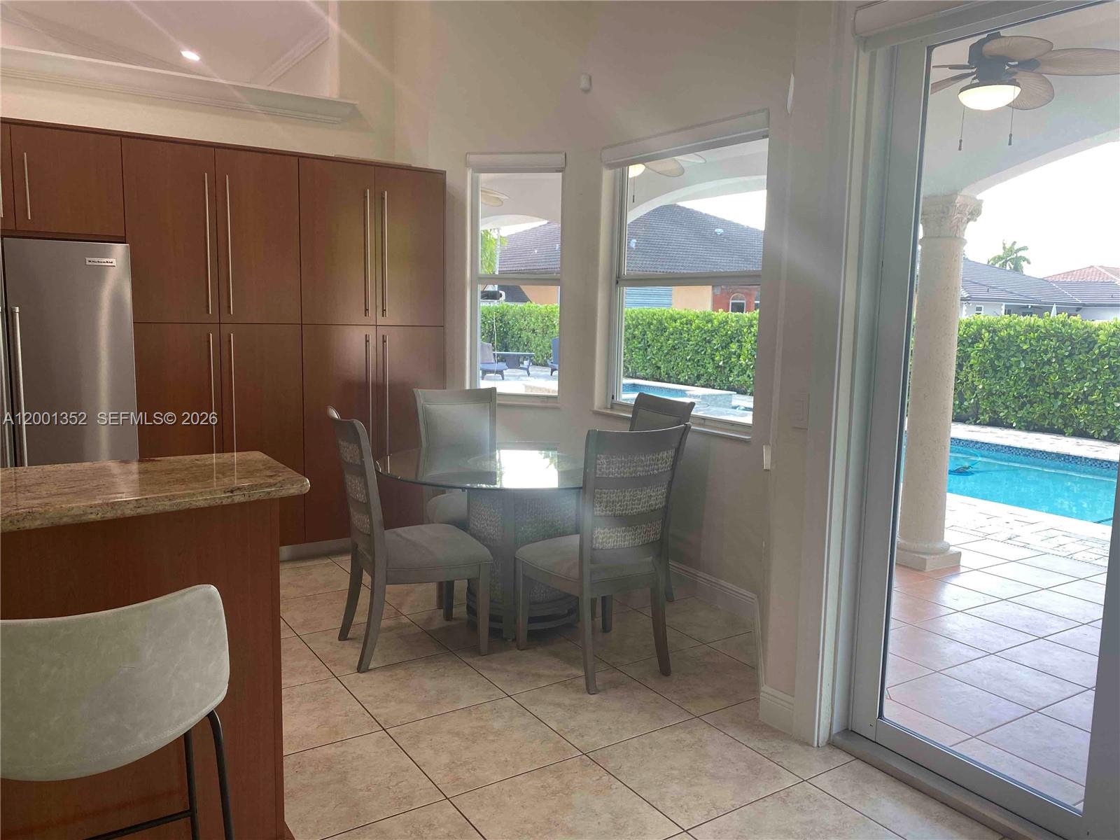 14302 Southwest 15th Street Miami, FL 33184 - Photo 23 of 63 a view of a dining room with furniture window and outside view