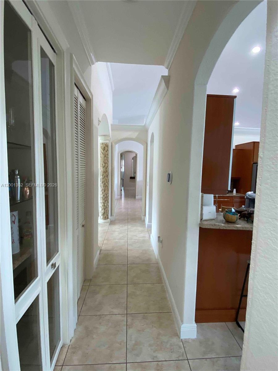 14302 Southwest 15th Street Miami, FL 33184 - Photo 35 of 63 a view of a hallway and a livingroom with a bathroom