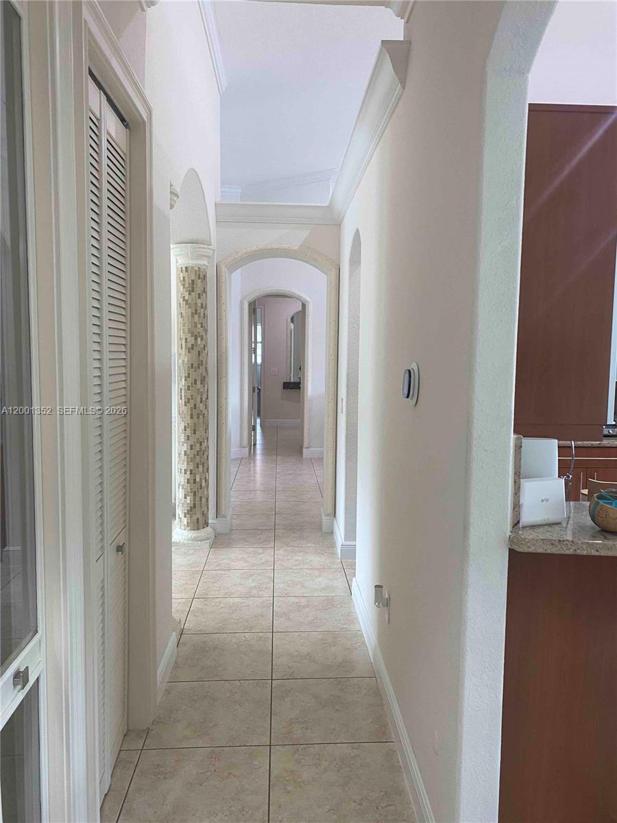 14302 Southwest 15th Street Miami, FL 33184 - Photo 36 of 63 a view of a hallway with a livingroom and a bathroom