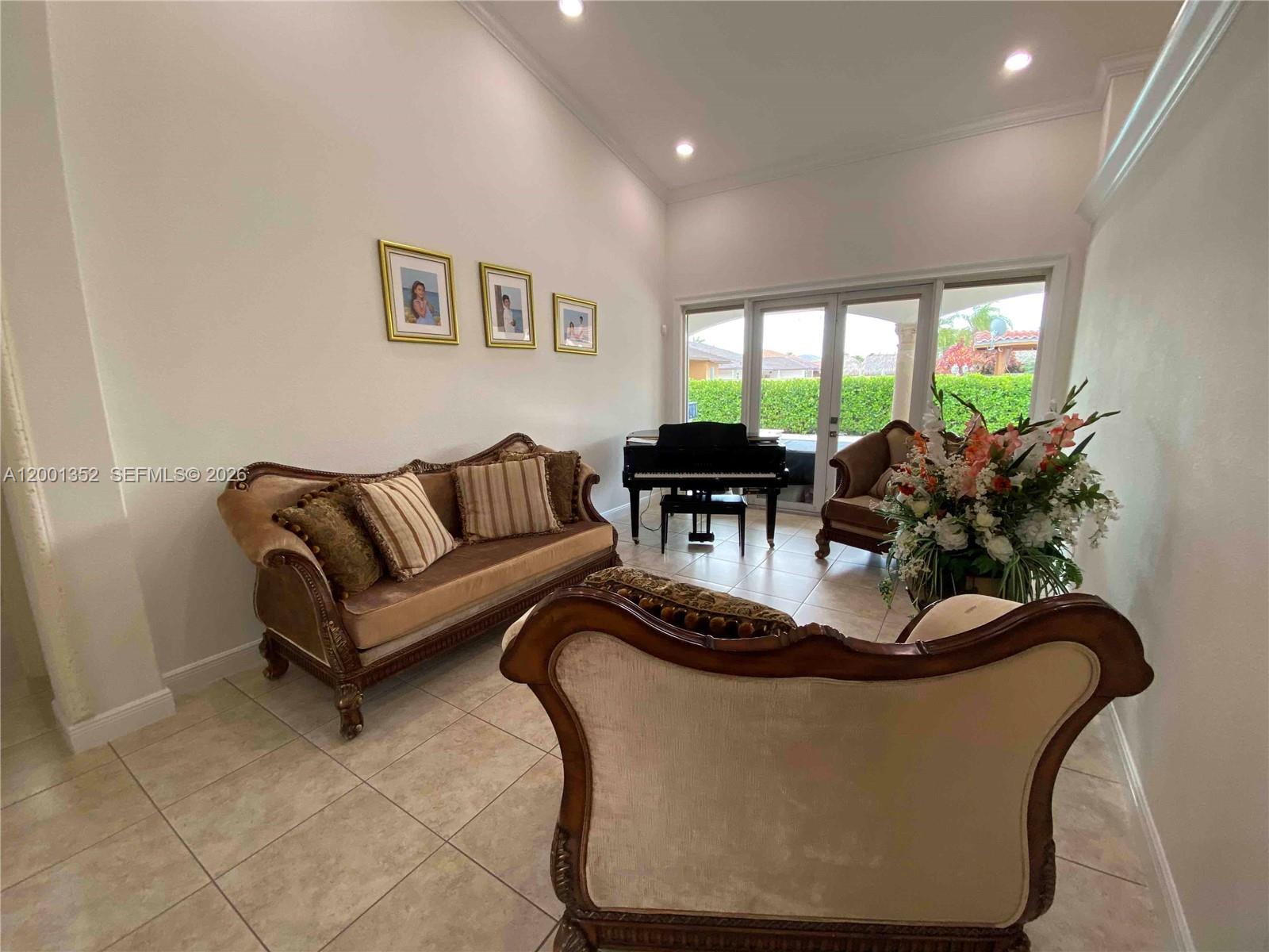 14302 Southwest 15th Street Miami, FL 33184 - Photo 45 of 63 a living room with furniture flowerpot and large window