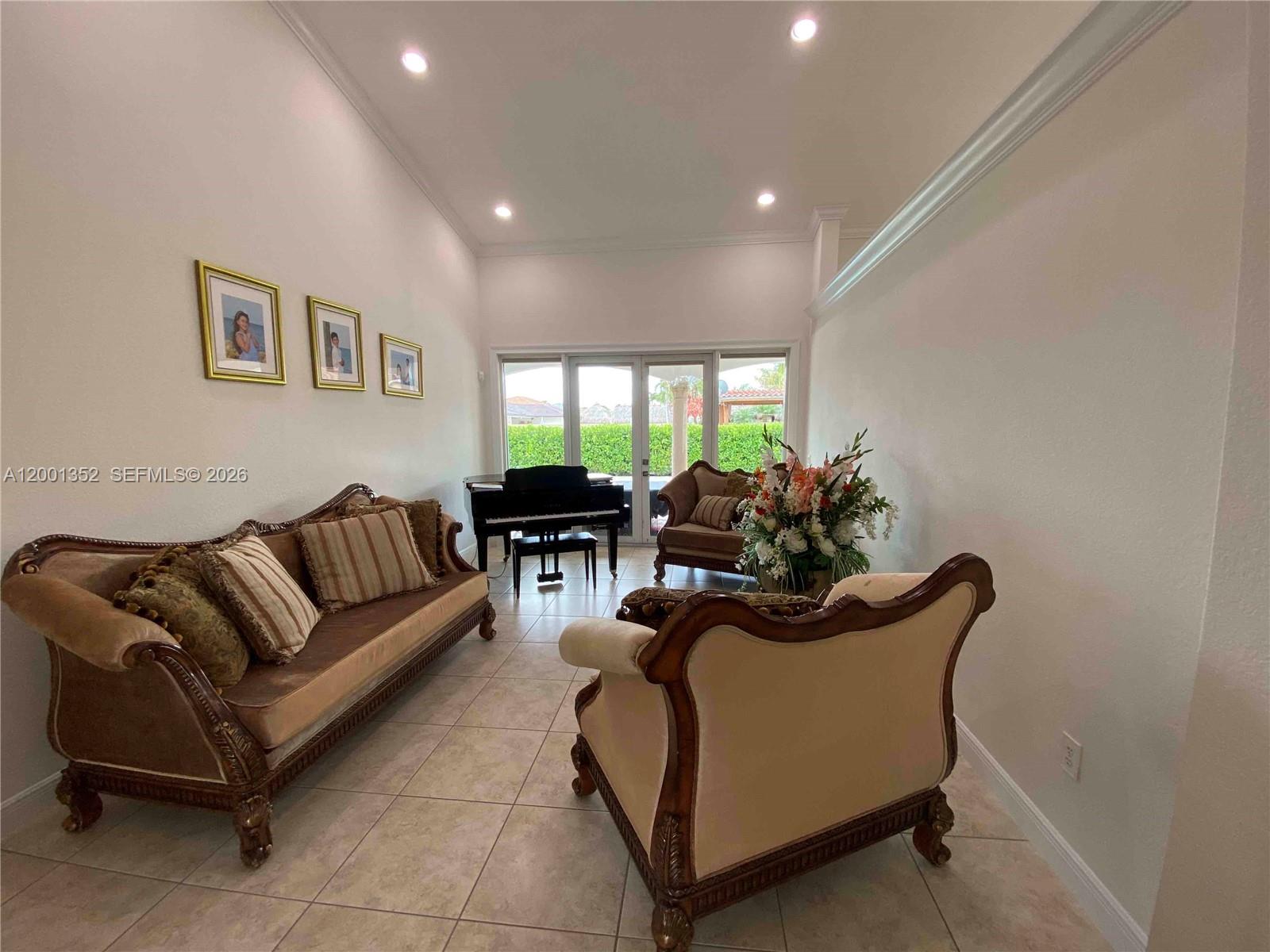 14302 Southwest 15th Street Miami, FL 33184 - Photo 46 of 63 a living room with furniture and a large window