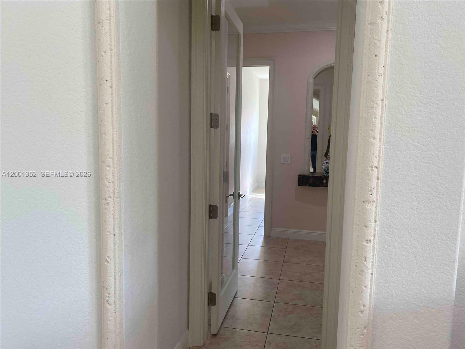 14302 Southwest 15th Street Miami, FL 33184 - Photo 48 of 63 a view of a bathroom from hallway with bathroom