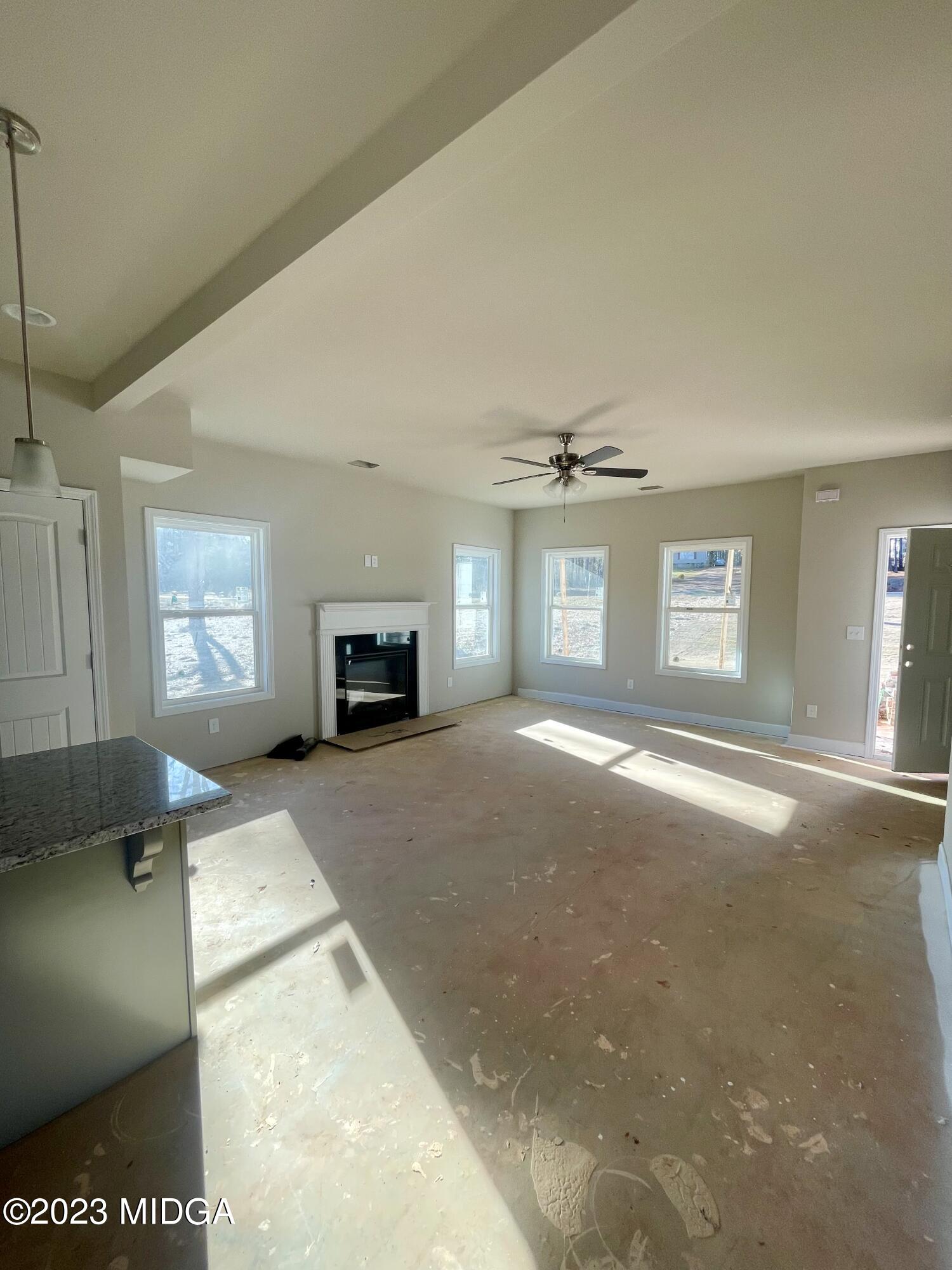 171 Strickland Loop Forsyth, GA 31029 - Photo 2 of 5 a bedroom with a bed and a window