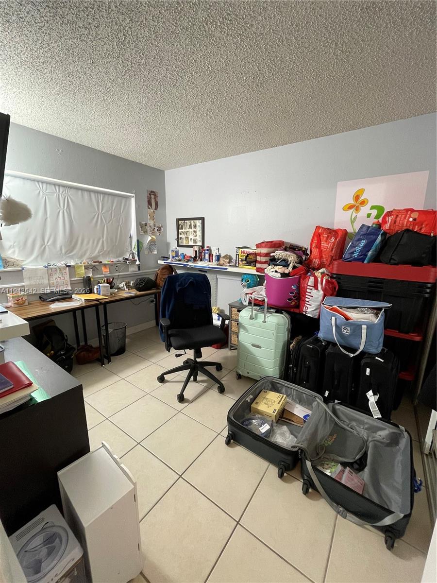 3270 Southwest 7th Street Miami, FL 33135 - Photo 21 of 25 a living room with furniture and a flat screen tv