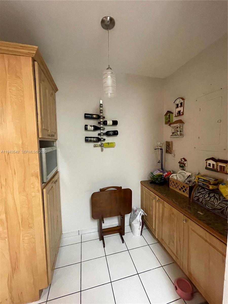 3270 Southwest 7th Street Miami, FL 33135 - Photo 23 of 25 a kitchen with stainless steel appliances a refrigerator and a stove top oven