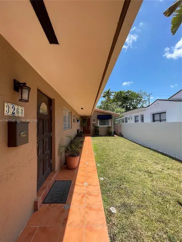 a view of hotel and patio