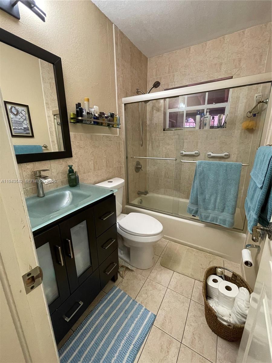 3270 Southwest 7th Street Miami, FL 33135 - Photo 3 of 25 a bathroom with a sink a toilet and shower