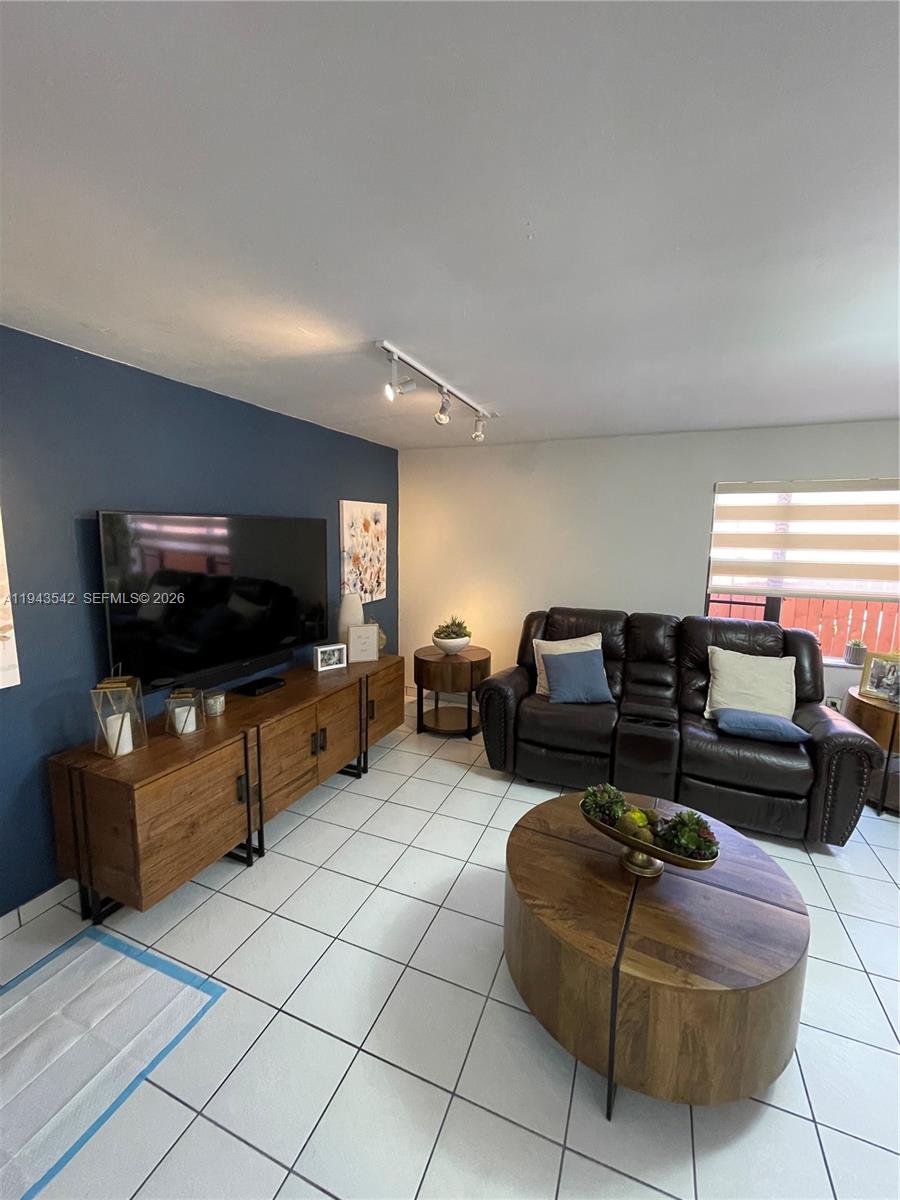 3270 Southwest 7th Street Miami, FL 33135 - Photo 7 of 25 a living room with furniture and a flat screen tv