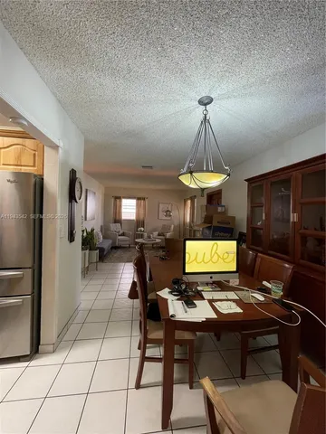 a view of a workspace with furniture