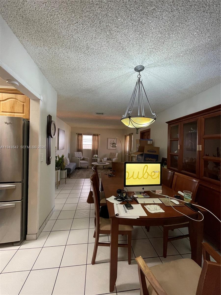 3270 Southwest 7th Street Miami, FL 33135 - Photo 8 of 25 a view of a workspace with furniture