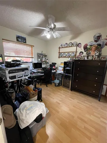 a view of a workspace with furniture