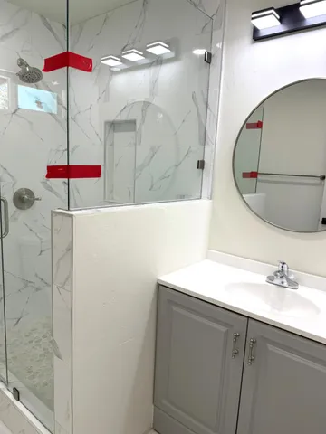 a bathroom with a sink and a mirror