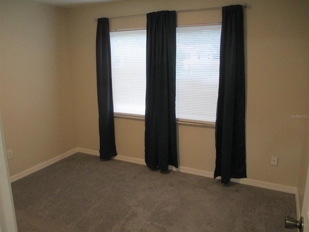 4469 Keyes Avenue Spring Hill, FL 34606 - Photo 20 of 27 an empty room with closet