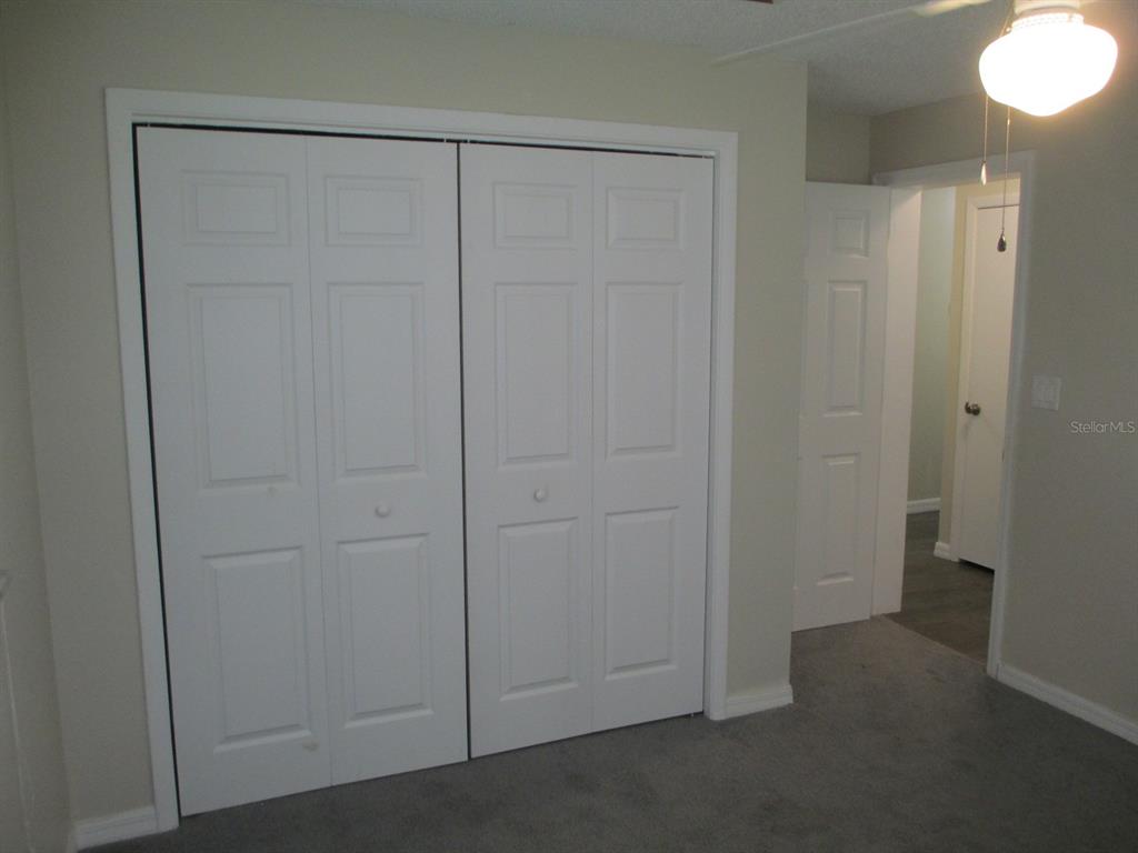 4469 Keyes Avenue Spring Hill, FL 34606 - Photo 21 of 27 an empty room with closet area