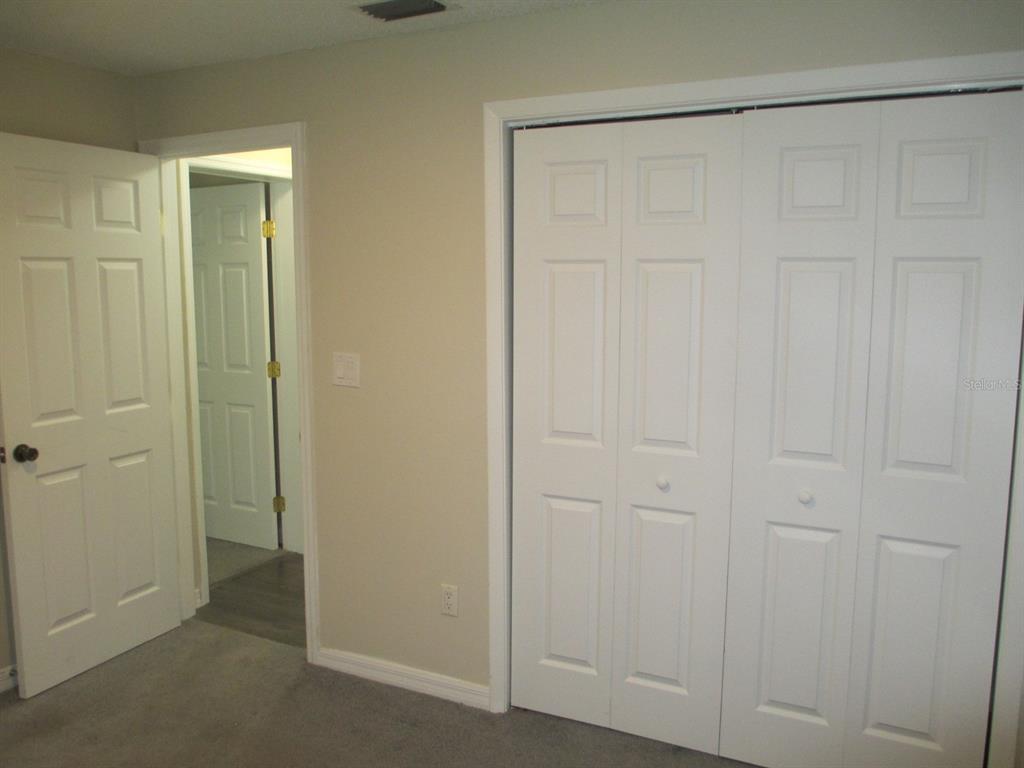 4469 Keyes Avenue Spring Hill, FL 34606 - Photo 24 of 27 an empty room with a wooden door