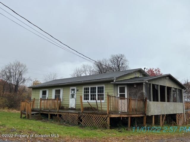 386 Campground Road Pittston, PA 18643 - Photo 3 of 13 a front view of a house with a garden