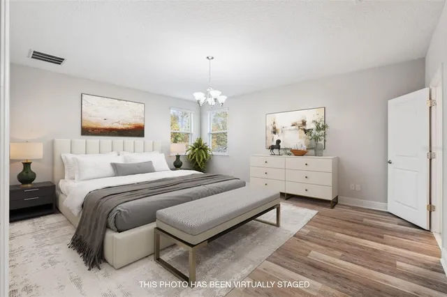 a bedroom with bed and window