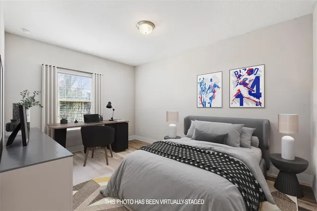 a bedroom with a bed and a couch