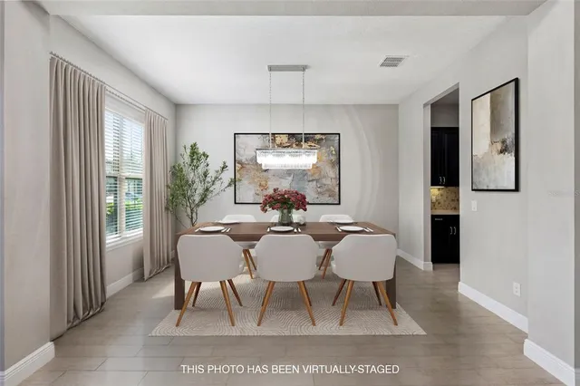 a view of a dining room with furniture window and outside view