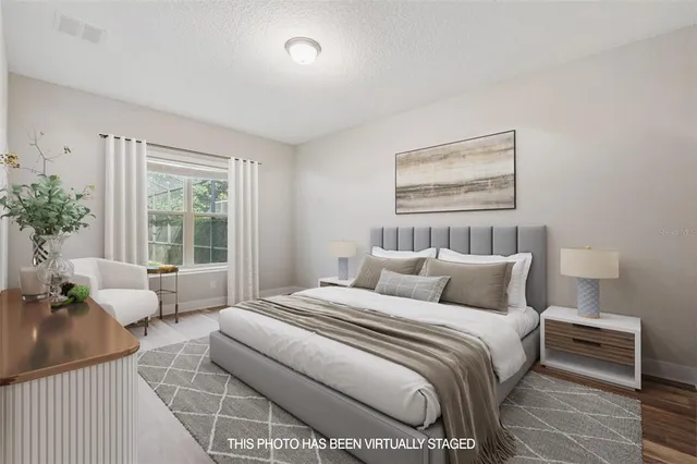 a bedroom with bed and glass window
