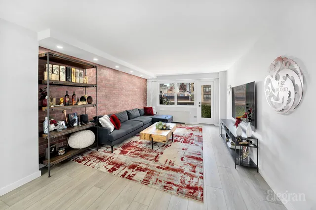 a kitchen with stainless steel appliances a white table and chairs in it