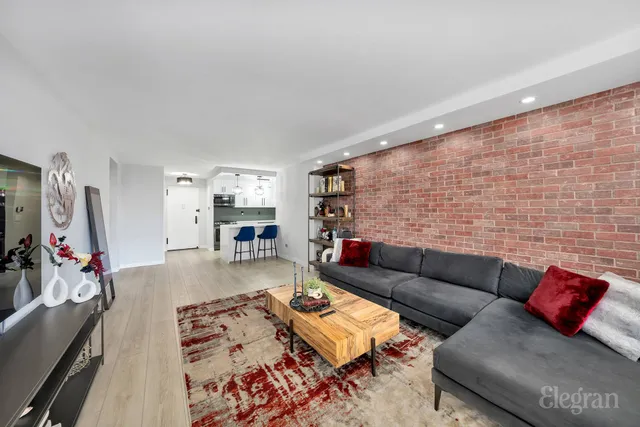 a bedroom with furniture and a wooden floor