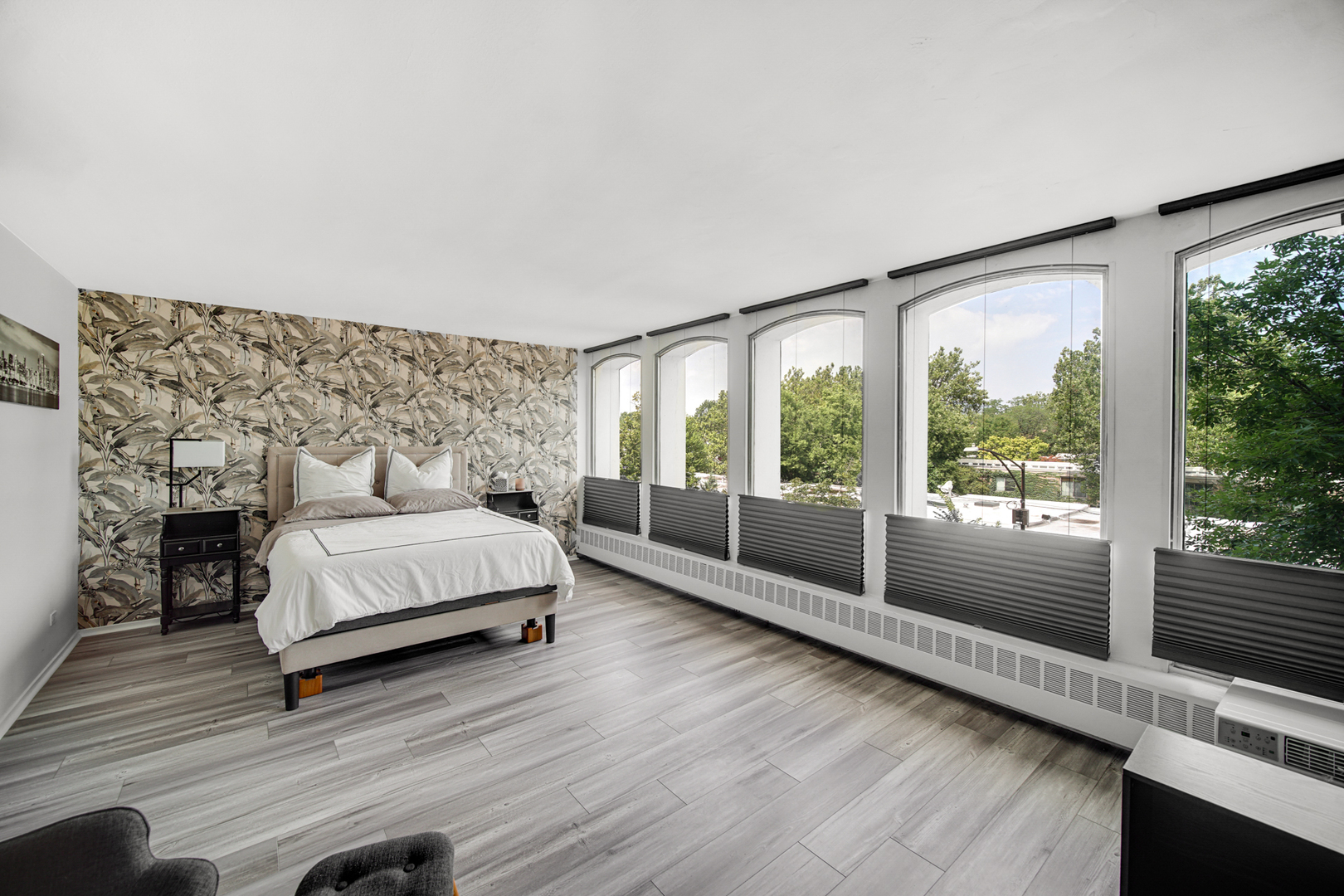 1401 East 55th Street, Unit 313N Chicago, IL 60615 - Photo 3 of 20 a bedroom with a bed and a large window