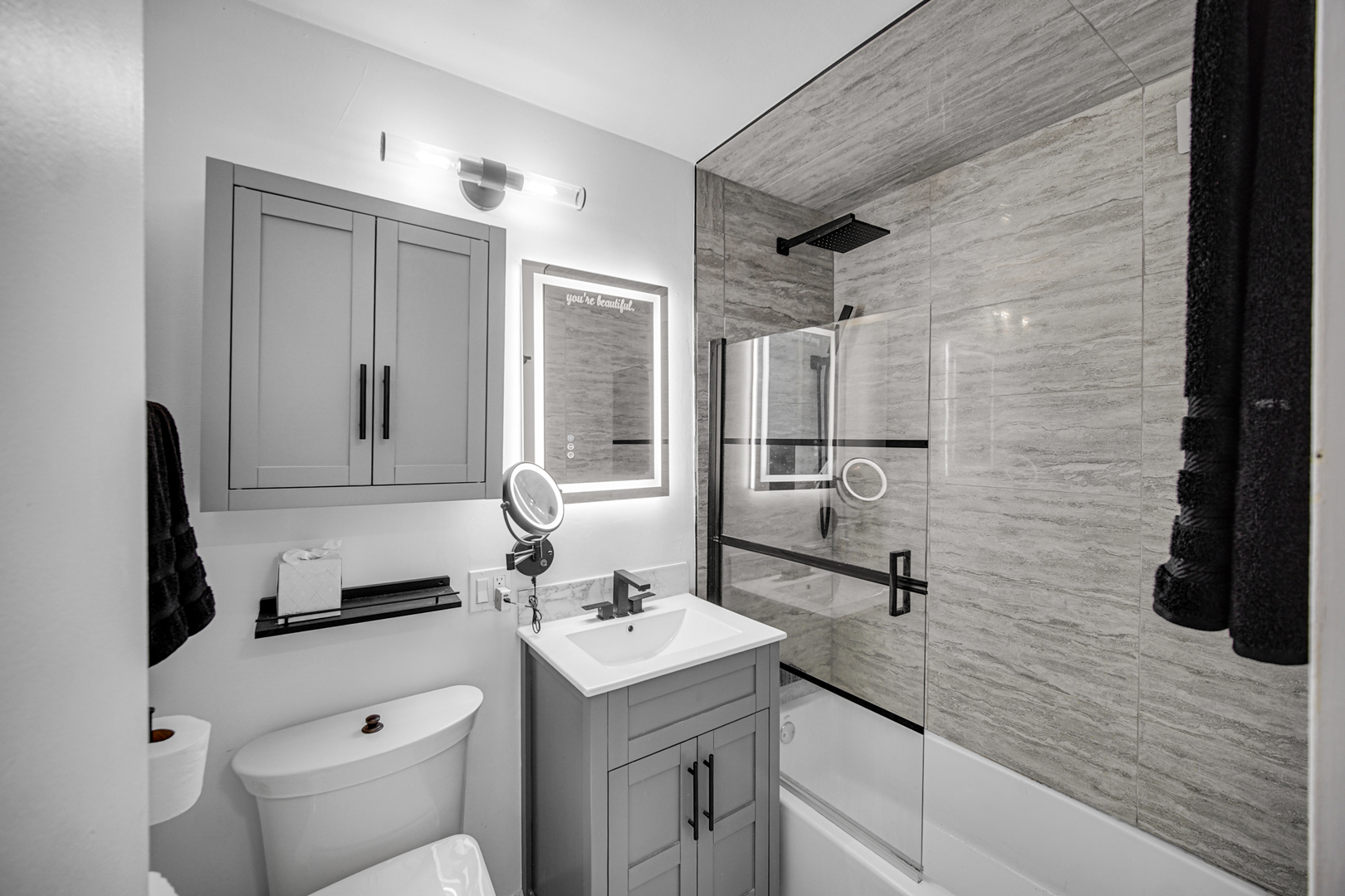 1401 East 55th Street, Unit 313N Chicago, IL 60615 - Photo 10 of 20 a bathroom with a sink toilet and shower