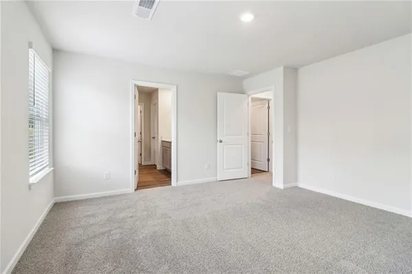 a view of empty room with closet