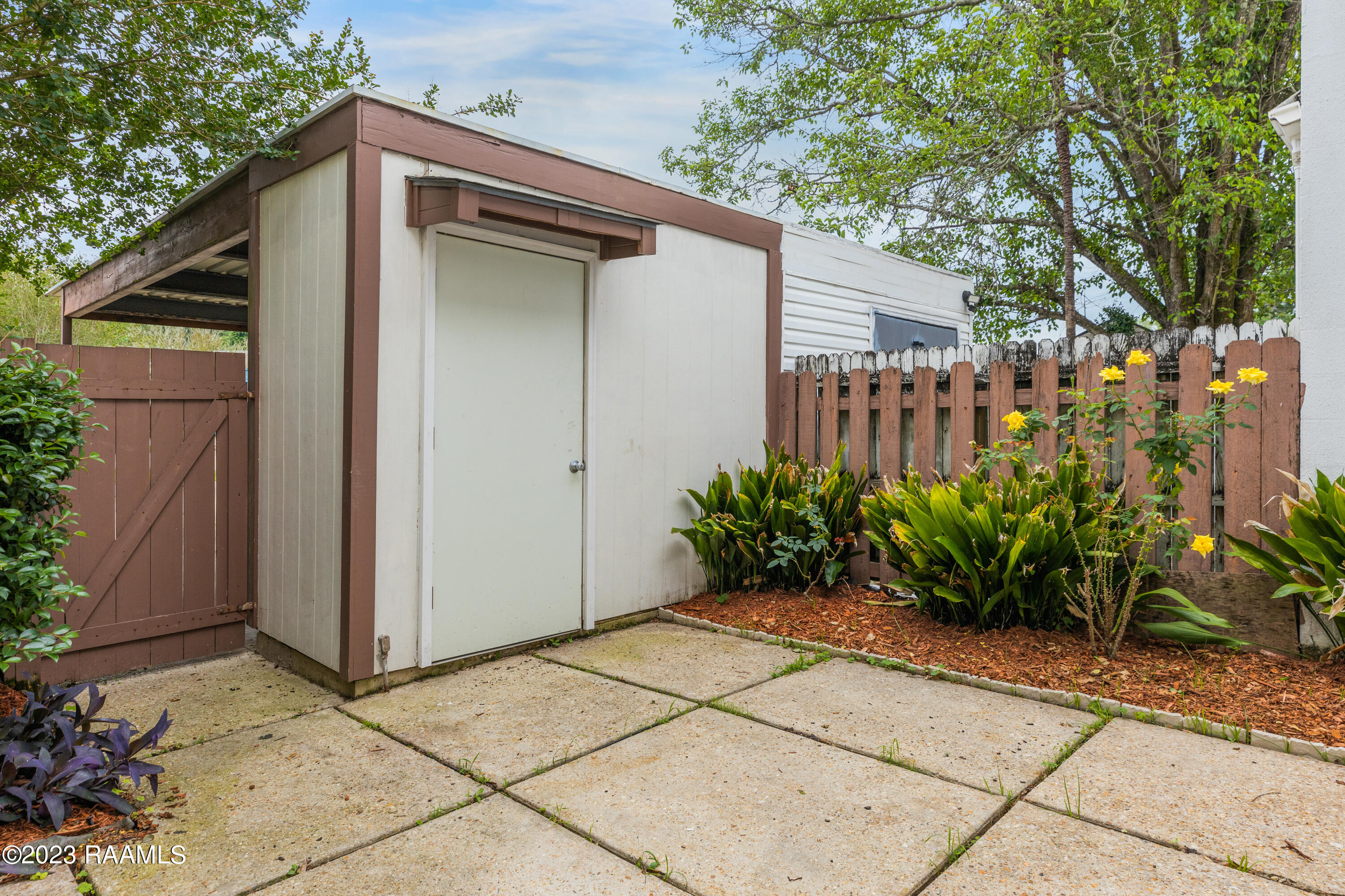 9 Morning Glory Square Lafayette, LA 70507 - Photo 12 of 15 Front patio facing storage/carport