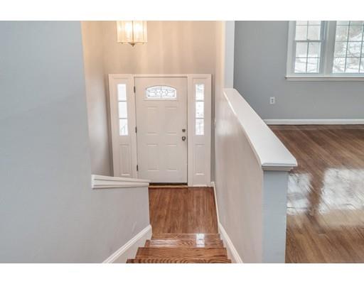 6 Woodmere Road Framingham, MA 01701 - Photo 1 of 15 a view of a hallway with front door