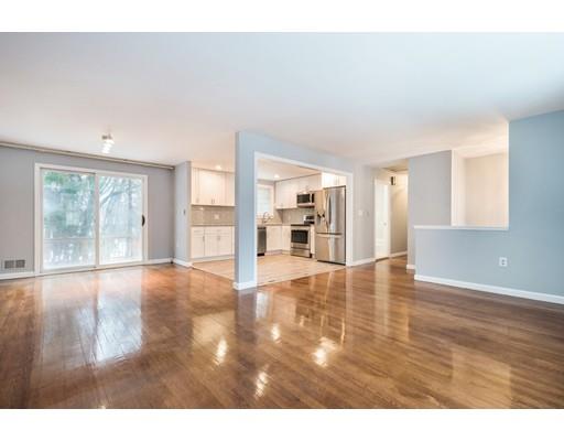 6 Woodmere Road Framingham, MA 01701 - Photo 2 of 15 a view of an empty room with wooden floor and a window