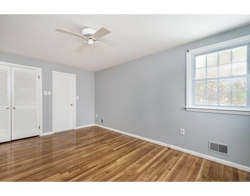 6 Woodmere Road Framingham, MA 01701 - Photo 5 of 15 a view of an empty room with wooden floor and a window