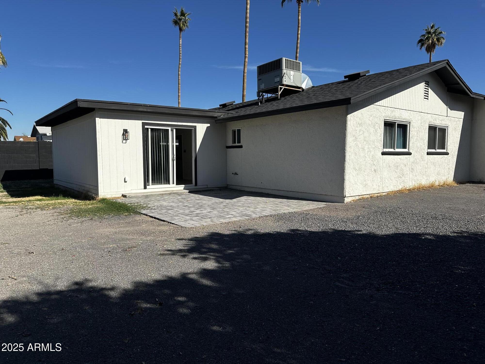 6818 South Terrace Road Tempe, AZ 85283 - Photo 11 of 11 a front view of a house with a garage